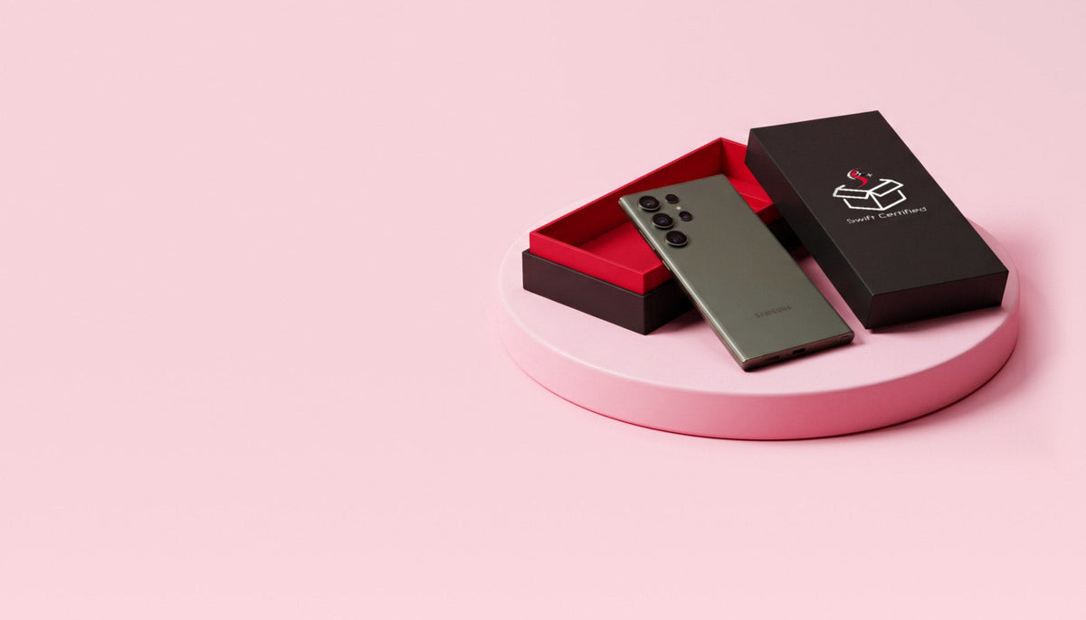 Phone in an open Swift Certified box on a pink podium